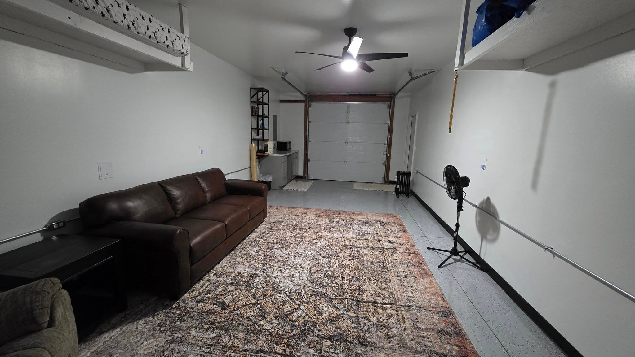 Finished interior with drywall, flooring, and furnished seating