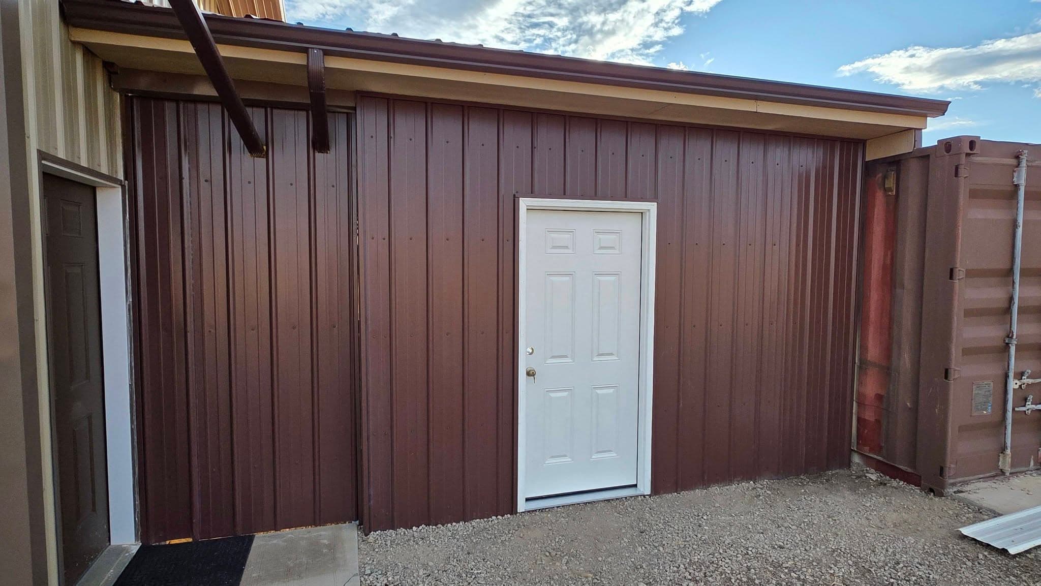 Finished metal building with burgundy siding